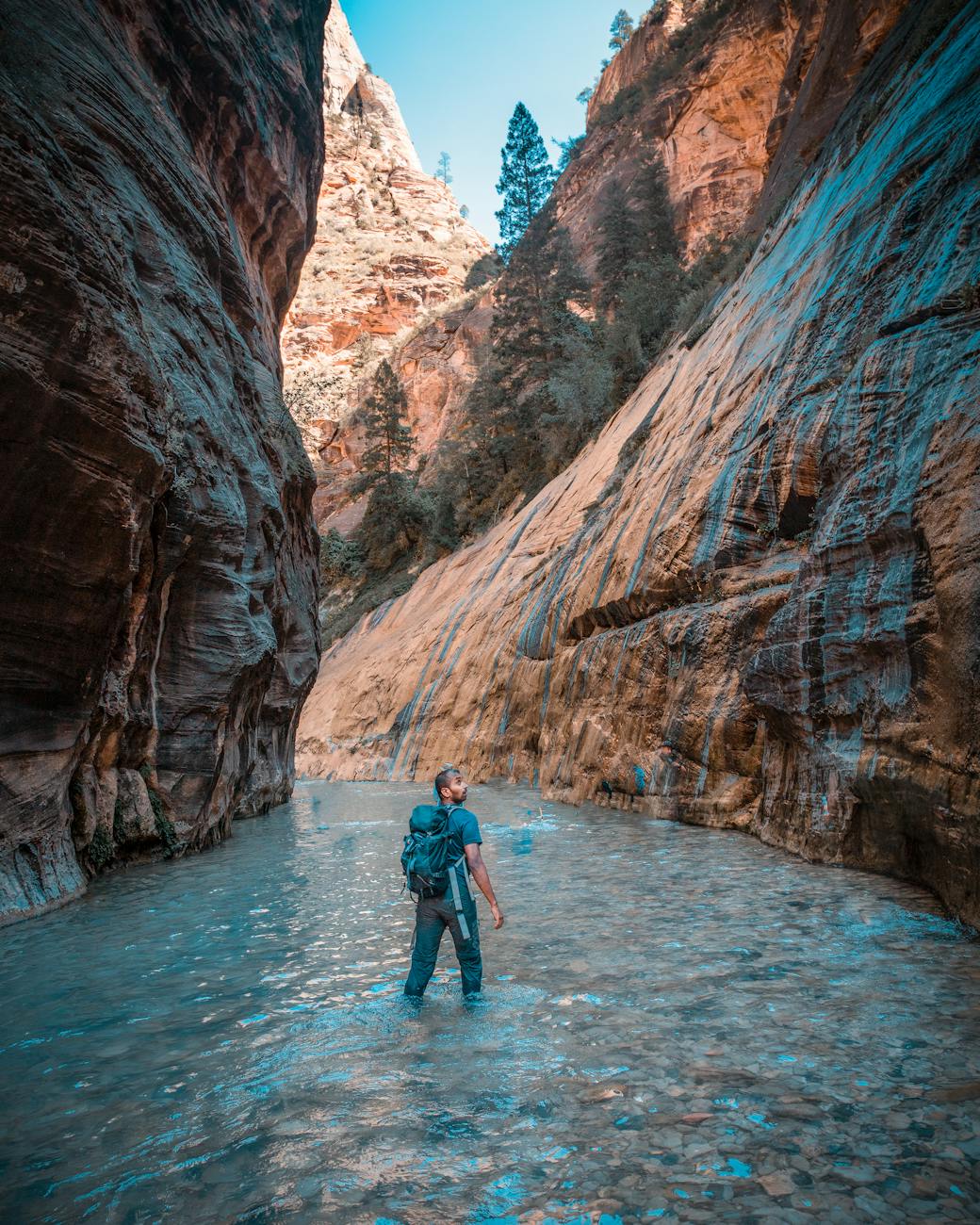 photo of person on river during daytime